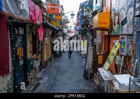 Tokyo, Japan - March 7, 2023: A street in the Golden Gai neighborhood in Shinjuku, Tokyo, Japan. Stock Photo