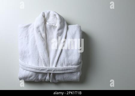 Clean folded bathrobe on white background, top view Stock Photo