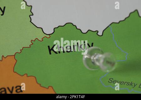 Map of Ukraine with transparent push pin placed on Kharkiv, closeup Stock Photo