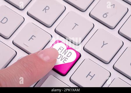 Woman pressing button with words Find Love on computer keyboard, closeup Stock Photo