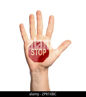 Woman showing palm with drawn STOP sign on white background, closeup Stock Photo