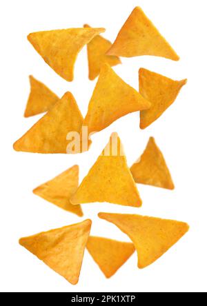 Tasty tortilla chips (nachos) falling into on white background Stock Photo