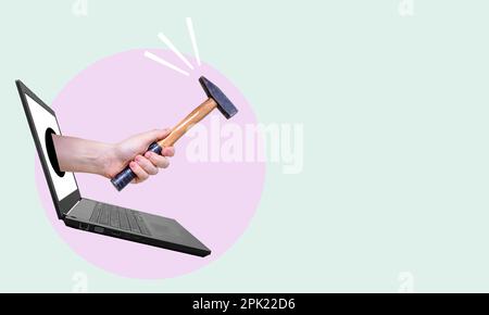 Collage art, the hand with hammer sticking out of laptop on a light background. The modern art of working behind a computer monitor. Stock Photo