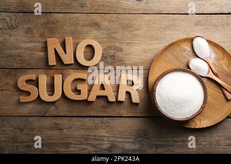 Flat lay composition with phrase No Sugar on wooden table Stock Photo