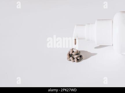 Texture of a dark face mask with white packaging on a white background Stock Photo