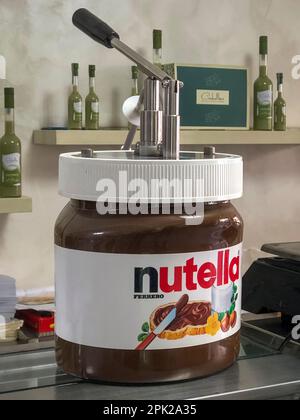 A dispenser for serving Nutella, the popular Italian hazelnut and chocolate  spread, often squeezed into brioches or croissants for a quick breakfast  Stock Photo - Alamy