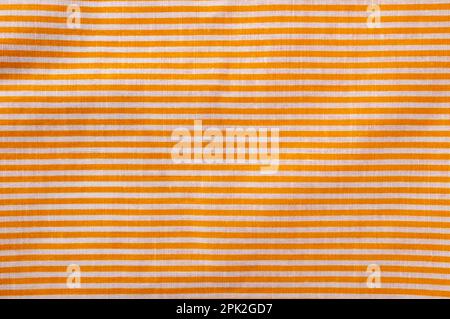 Orange and white striped cotton texture. Fabric textile background Stock Photo