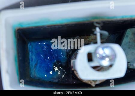 Old white ceramic toilet bowl. Toilet room renovation. Selective focus Stock Photo