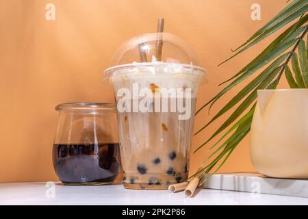 Tapioca boba balls coffee frappe, asian trendy cold coffee drink with tapioca balls and whipped coconut cream and caramel sauce Stock Photo