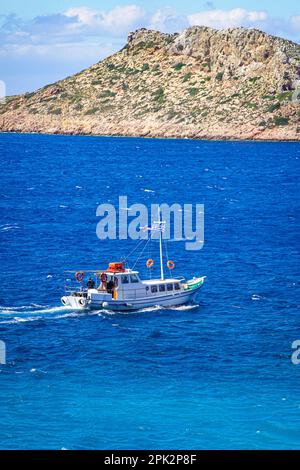 Taxi boat Crossing Telendos A Small Island Off Kalymnos Greek Island taxi-boat-crossing-telendos-a-small-island-off-kalymnos-greek-island