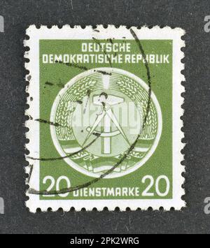 cancelled postage stamp printed by East Germany, that shows Coat of arms, circa 1952. Stock Photo