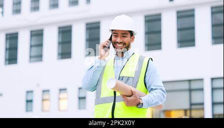 Excited, confident and happy architect talking on phone, agreeing to building plan for office development in city. Cheerful, ambitious contractor or Stock Photo