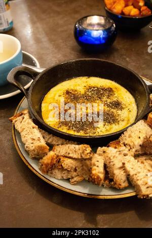 Turkish cheese fondue with za'atar spice at Megan's at the Battersea Power Station, London, UK Stock Photo