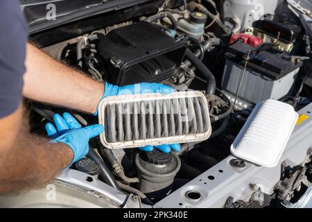 Automotive engine air filter replacement Stock Photo