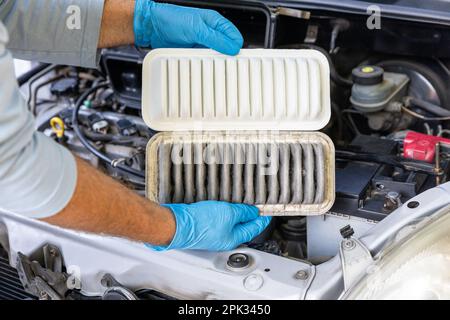 Automotive engine air filter replacement Stock Photo