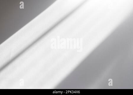 Abstract lines, shadows, light from window on white paper as overlay, texture or background Stock Photo