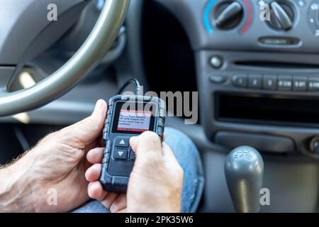 Using a car scan tool for repair diagnostics and check engine Stock Photo