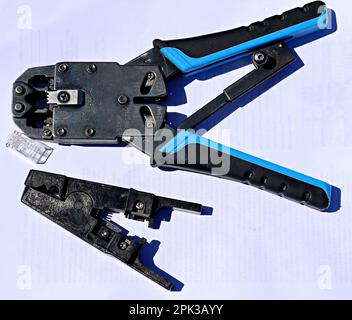 Ethernet cable Crimping tools on a white background Stock Photo