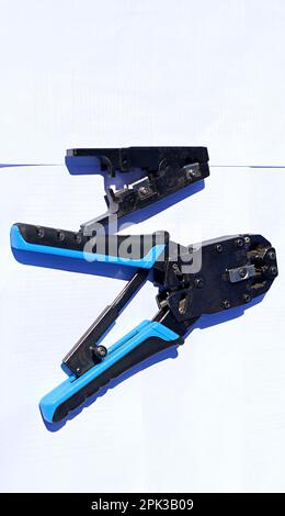 Ethernet cable Crimping tools on a white background Stock Photo