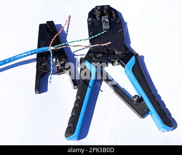 Ethernet cable Crimping tools on a white background Stock Photo