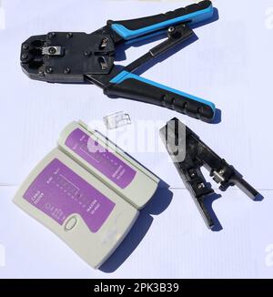 Ethernet cable Crimping tools on a white background Stock Photo