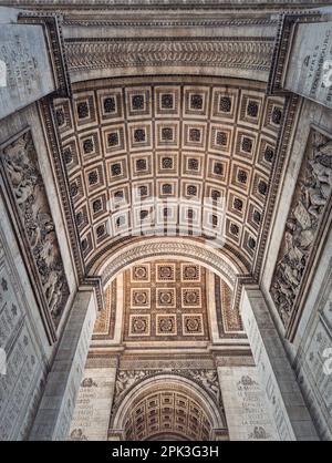 View underneath triumphal Arch in Paris, France. Arc de triomphe, famous historic landmark architecture details Stock Photo