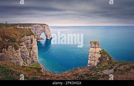 Beautiful view to the Porte d'Aval natural arch at Etretat famous cliffs in Normandy, France Stock Photo