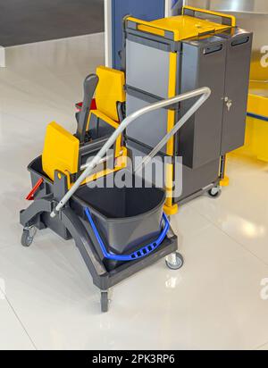 Janitorial Equipment Bucket Cart Trolley and Supply Cabinet With Wheels Stock Photo