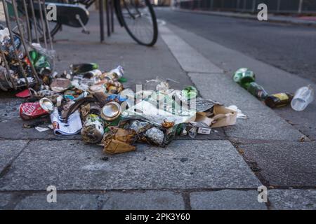 Garbage on the sidewalk close up in Paris, France. March 24, 2023. Stock Photo