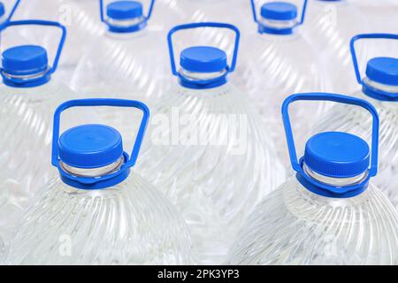 Water in plastic bottles on a white background, isolated Stock Photo