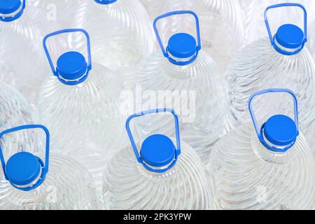 Water in plastic bottles on a white background, isolated Stock Photo