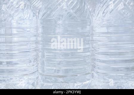 Water in plastic bottles closeup, background Stock Photo