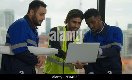 Construction engineer discussing and brainstorming with architects workers Stock Photo