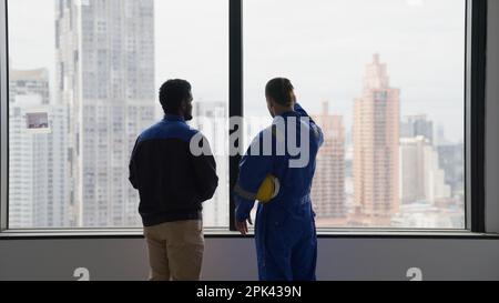 Engineer and electrician working together checking and inspecting new building Stock Photo