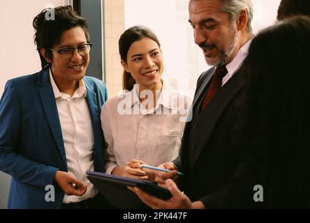 Close up of business officer teamwork brainstorming and talking Stock Photo