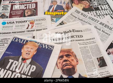 Headlines of newspapers in New York on Friday, March 31, 2023 report on the previous day’s announcement of former President Donald Trump being indicted over the alleged payment of hush money to Stormy Daniels. (© Richard B. Levine) Stock Photo
