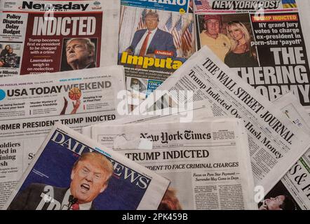 Headlines of newspapers in New York on Friday, March 31, 2023 report on the previous day’s announcement of former President Donald Trump being indicted over the alleged payment of hush money to Stormy Daniels. (© Richard B. Levine) Stock Photo