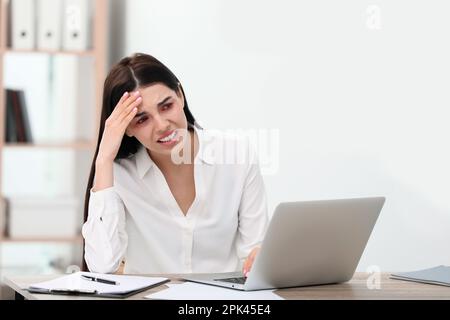 Tired woman with red eyes at workplace in office Stock Photo - Alamy