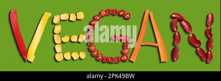 Word VEGAN made of different fresh tasty vegetables on green background, flat lay. Banner design Stock Photo