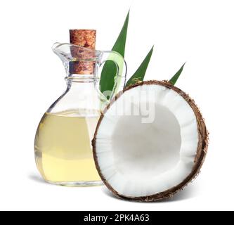 Bottle of coconut cooking oil and fruit on white background Stock Photo