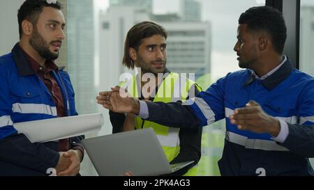 Construction engineer discussing and brainstorming with architects workers Stock Photo
