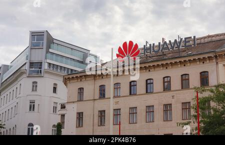 Vienna, Austria - August 7, 2022: Huawei logo on old building wall. Huawei is leading global provider of information and communications technology inf Stock Photo