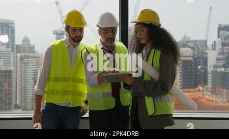 Group of professional civil engineers team working on new building Stock Photo