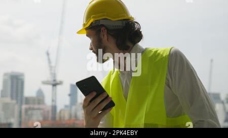 Portrait of smart engineer foreman with safety helmet and vest Stock Photo
