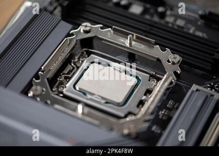 Replacing and installing a new processor in a home laptop computer Stock Photo