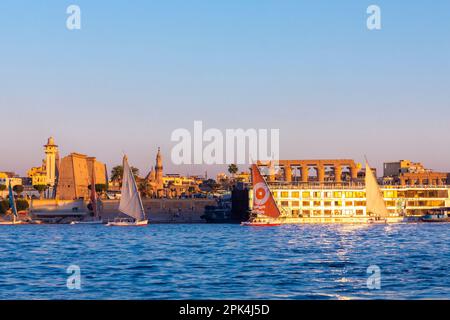 Feluccas On The River Nile At Sunset, Luxor, Egypt, North East Africa Stock Photo
