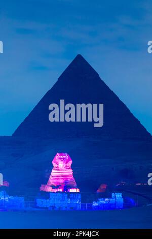 The Great Sphinx of Giza And The Pyramid of Khafre Illuminated, Giza, Egypt, North East Africa Stock Photo