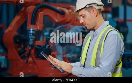 Programming robot controller, Programming robotic arms in factory ...