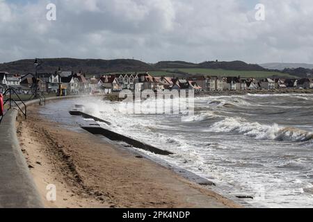 High tide and stormy seas batter the West shore of Llandudno, North Wales on a windy March day Stock Photo