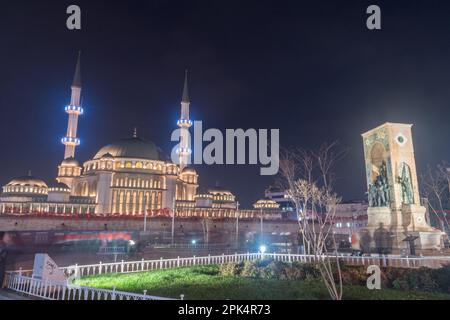 Istanbul, Turkey - December 10, 2022: Night view on Taksim Mosque (Turkish: Taksim Camii) and Republic Monument at Taksim Square, crafted by Italian s Stock Photo